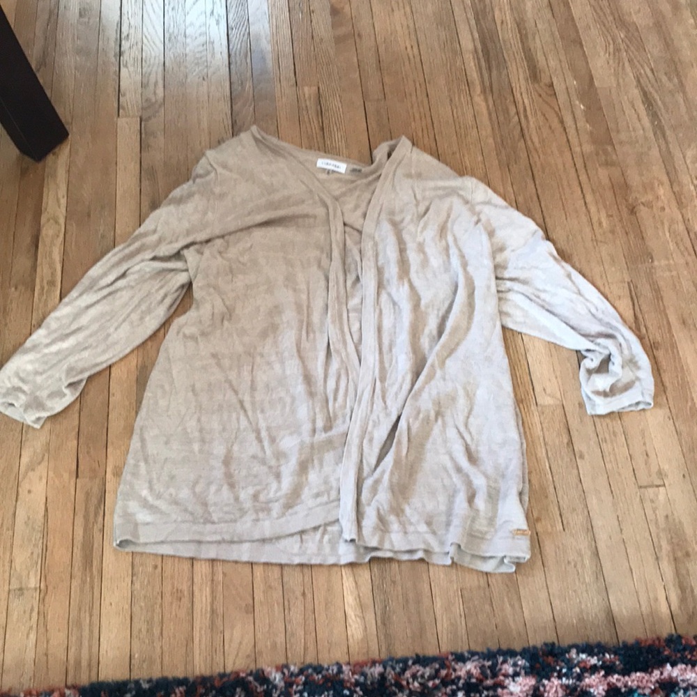 Tan cardigan sweater.